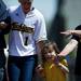 Natalie Harper walks with senior Amy Knapp and her family after the game against Northwestern on Sunday, May 5. Daniel Brenner I AnnArbor.com